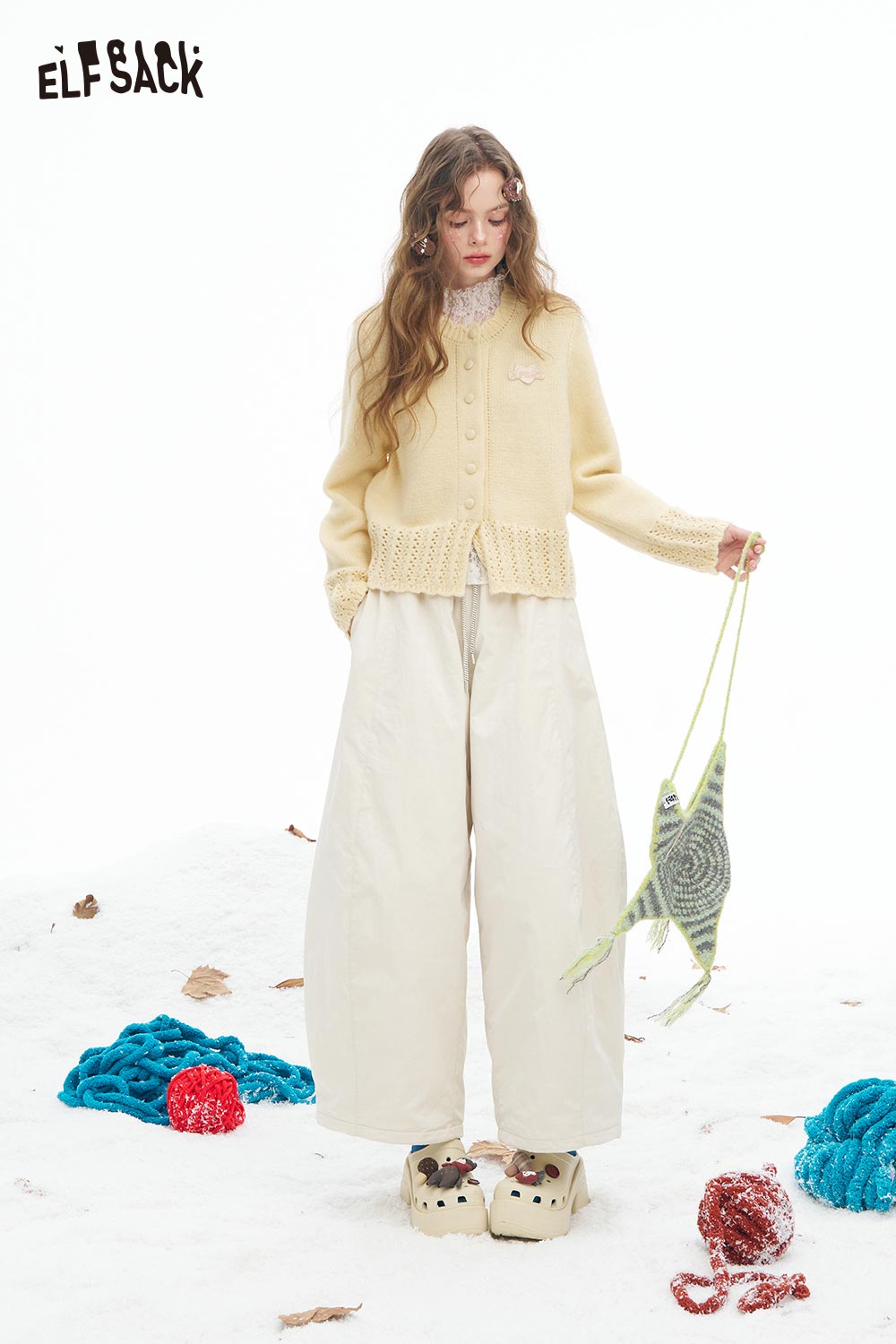 ELFSACK cute knit embroidered sweater for women in a soft yellow color, styled with wide pants