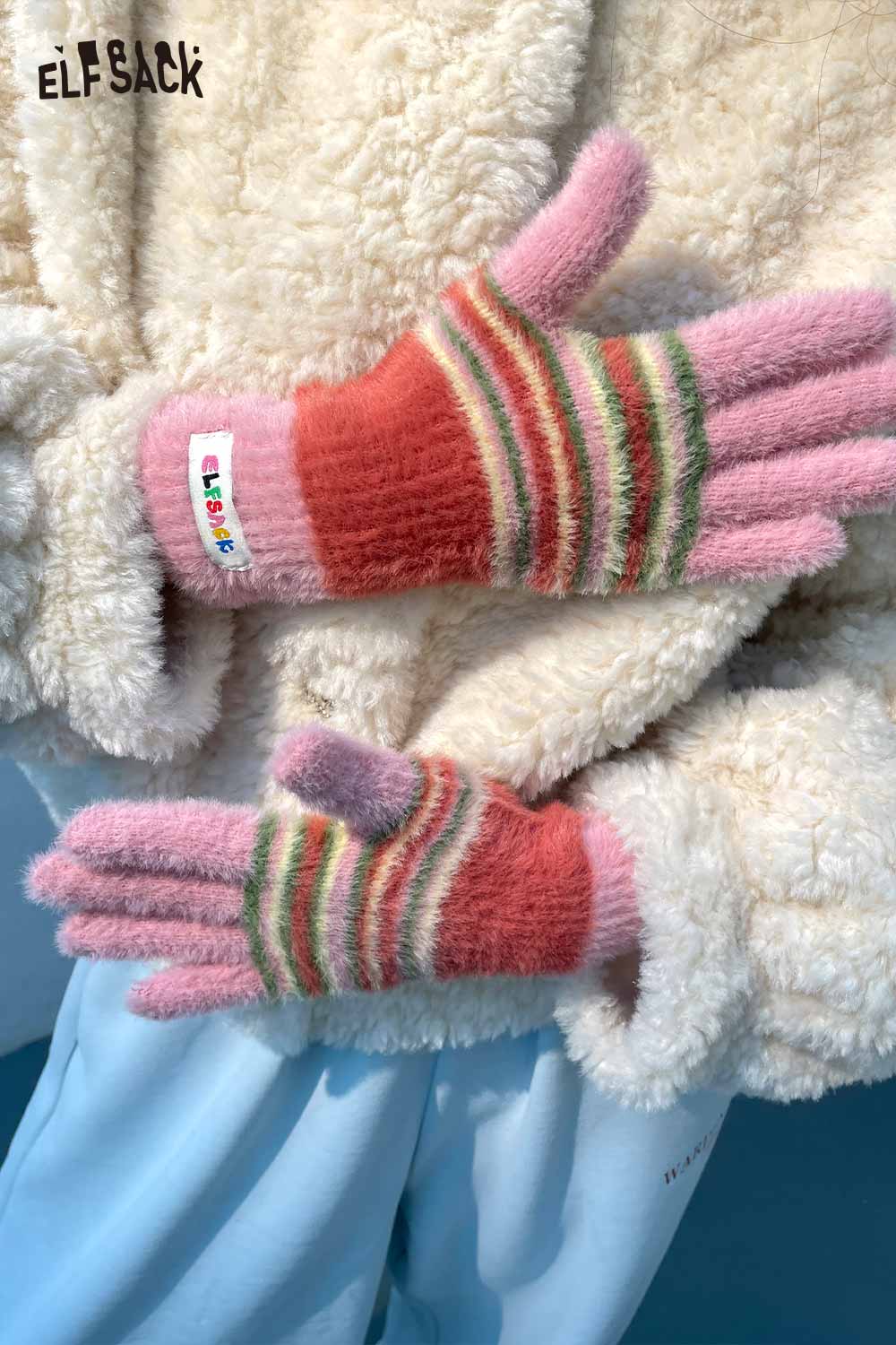 Cute striped finger gloves in pink and coral, designed for warmth and style from ELFSACK