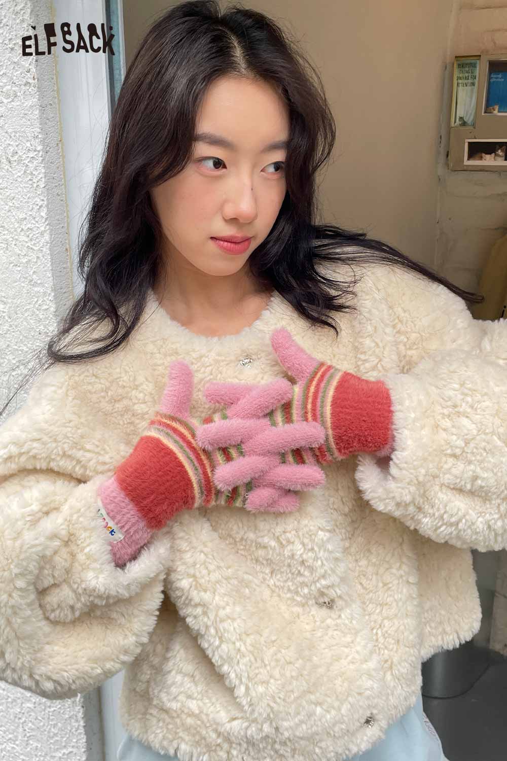 Cute striped finger gloves by ELFSACK in pink and red, perfect for chilly weather styling