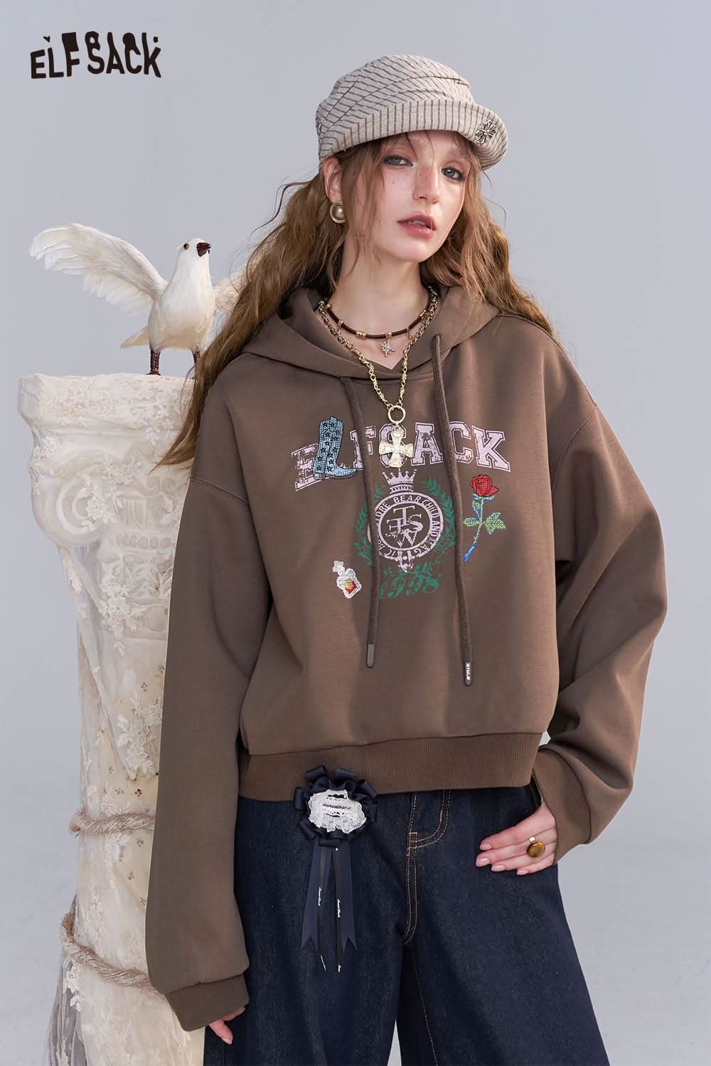 ELFSACK embroidered floral fleece hoodie in brown with playful design and relaxed fit