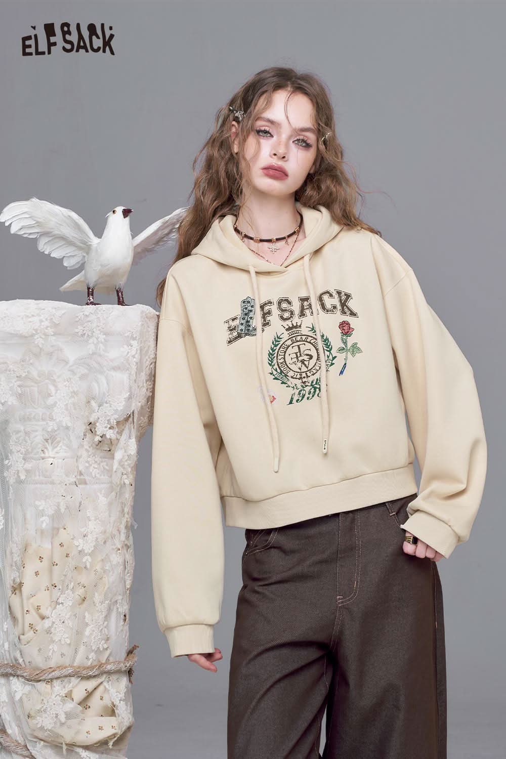 ELFSACK embroidered floral fleece hoodie in cream color with stylish floral detailing and adjustable drawstrings