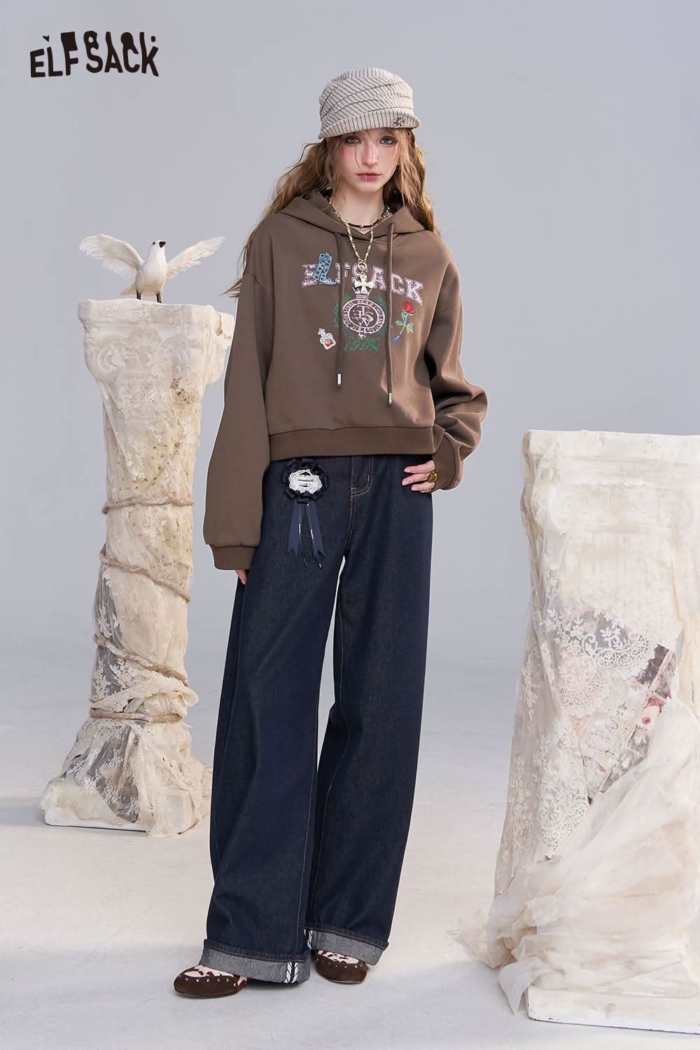 ELFSACK embroidered floral fleece hoodie in brown, paired with wide-leg denim pants for a stylish casual look