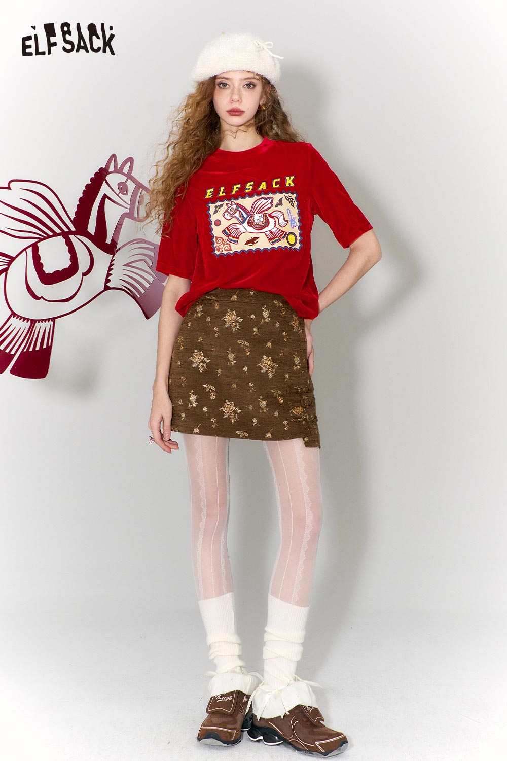 ELFSACK flying horse print t-shirt in red, styled with a brown skirt and white leggings for a trendy look