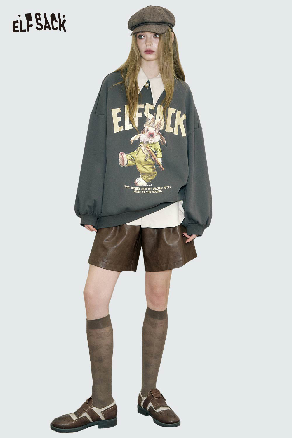 ELFSACK oversized graphic sweatshirt for women in dark gray with playful design, styled with shorts and knee-high socks