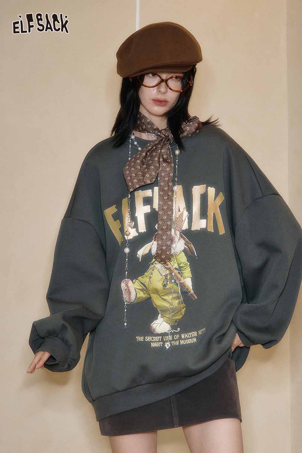 ELFSACK oversized graphic sweatshirt for women with unique design and relaxed fit, styled with accessories