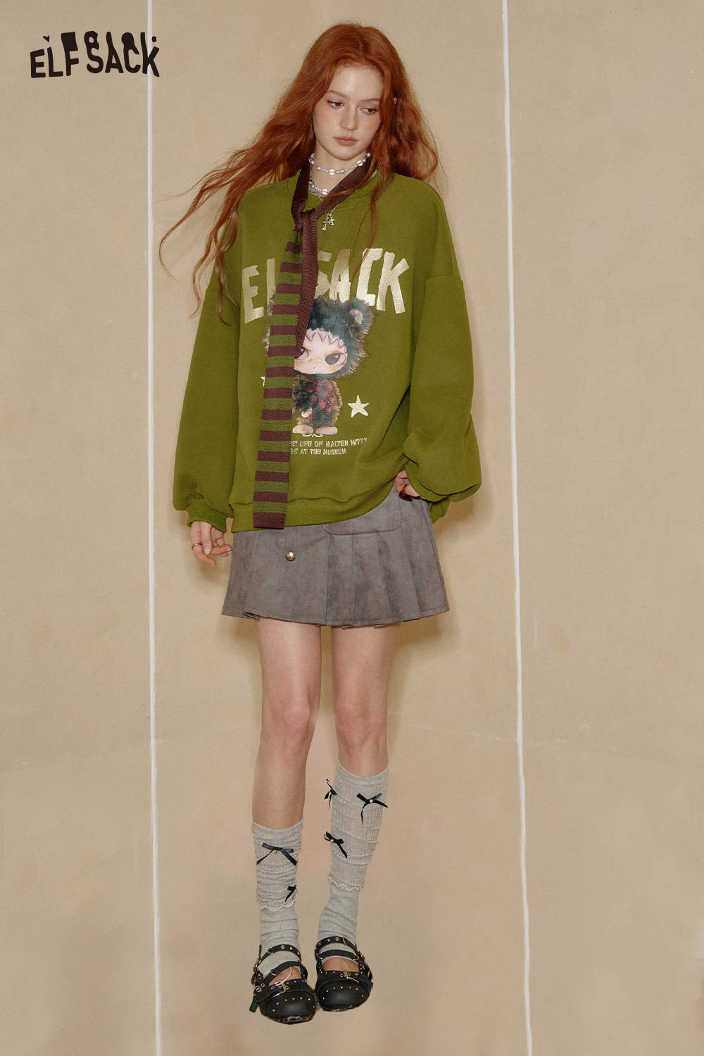 Stylish ELFSACK oversized graphic sweatshirt for women in green with unique print and relaxed fit