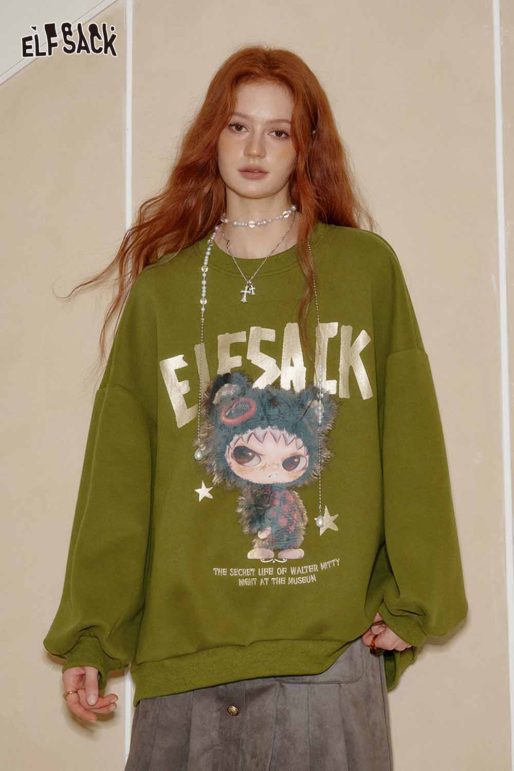 ELFSACK oversized graphic sweatshirt for women in olive green with playful character design