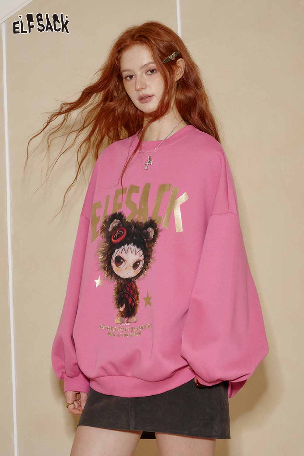 ELFSACK oversized graphic sweatshirt for women in pink with playful cartoon design and relaxed fit
