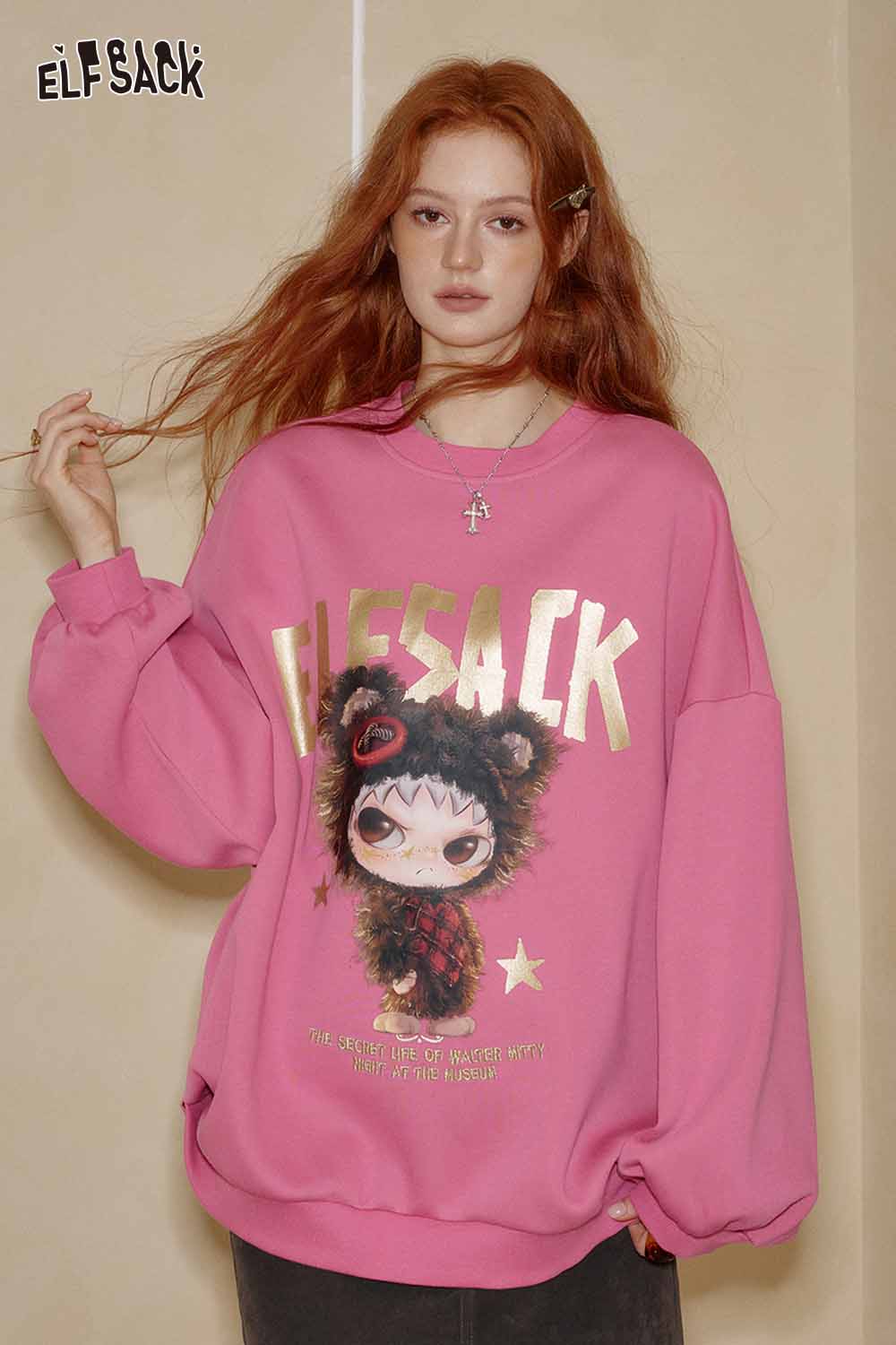 ELFSACK oversized graphic sweatshirt for women in pink with playful cartoon design and relaxed fit
