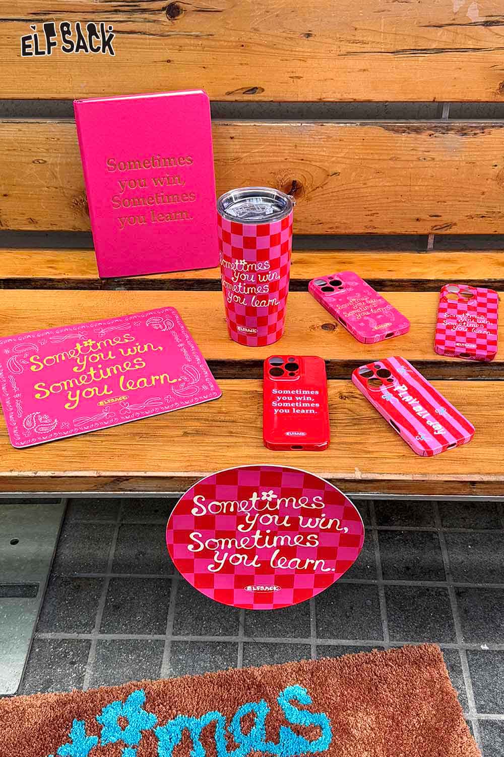 ELFSACK plaid stainless steel tumbler surrounded by matching accessories and vibrant decor