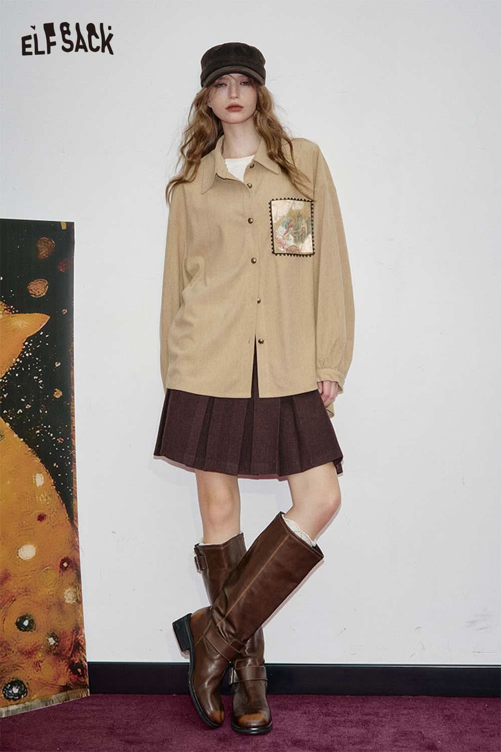 ELFSACK soft art print oversized shirt in beige with unique design and relaxed fit, styled with a skirt and boots