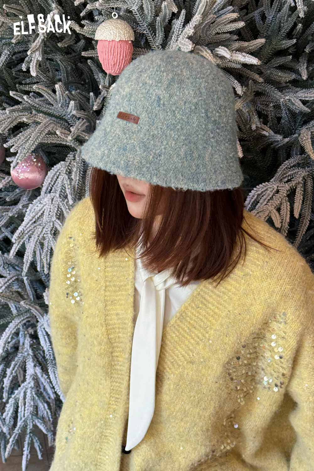 ELFSACK soft wool knit bucket hat in light blue, perfect for cozy winter styles