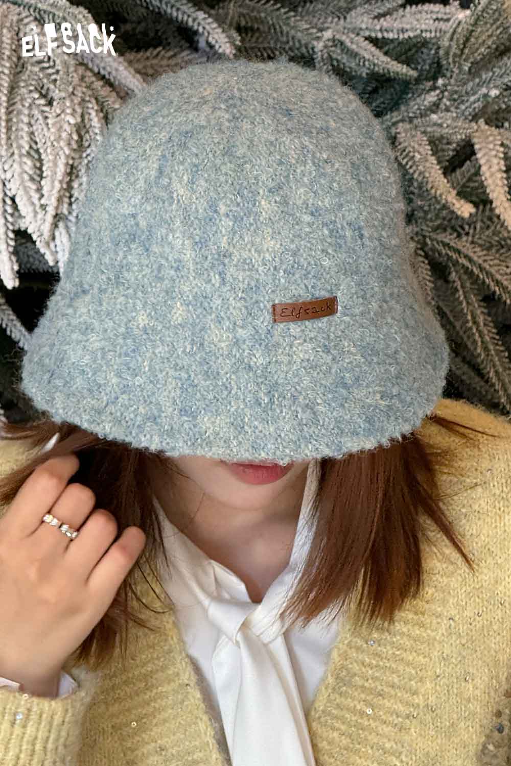 ELFSACK soft wool knit bucket hat in blue, perfect for stylish winter outfits