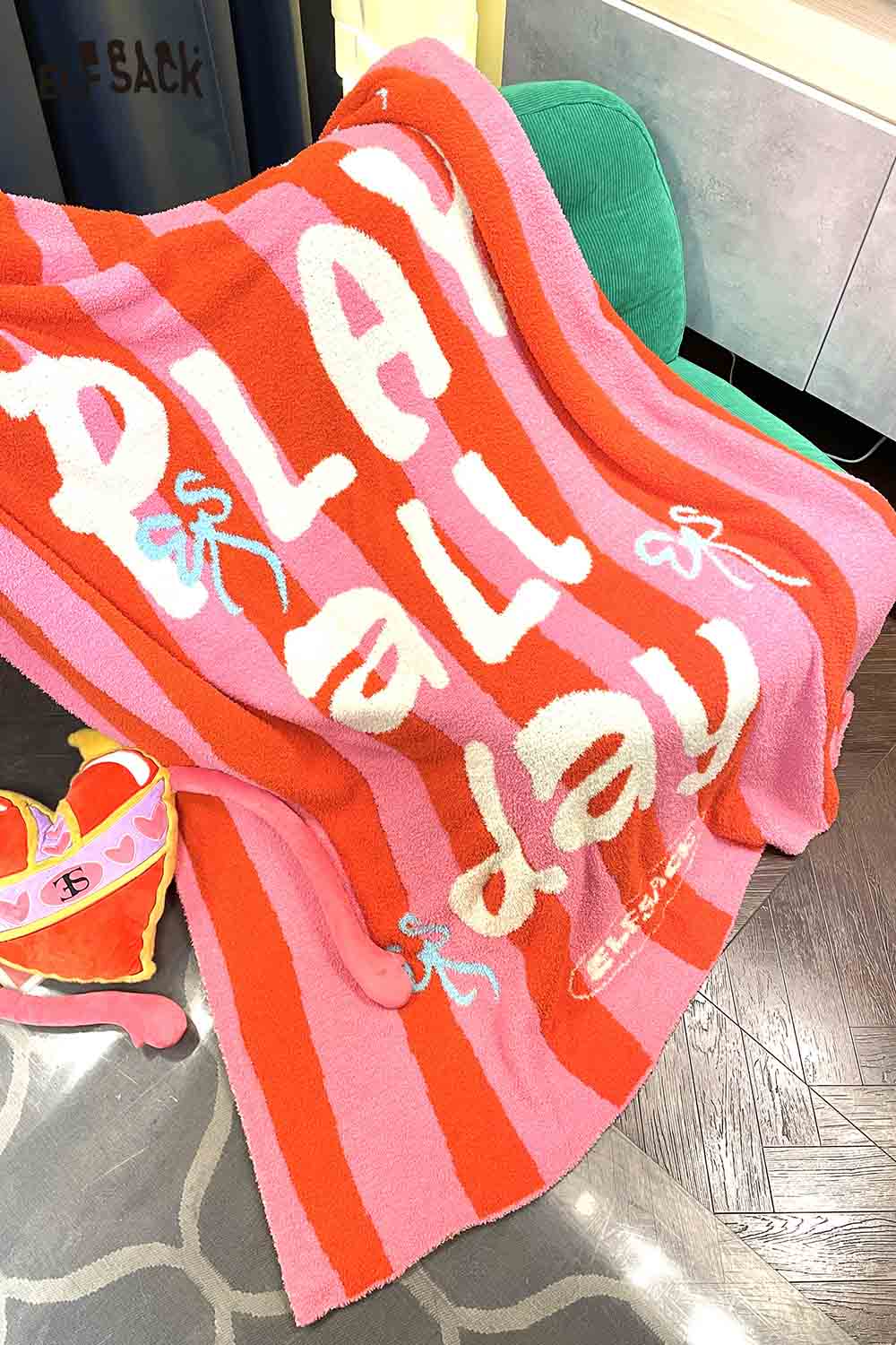 ELFSACK striped color block home blanket featuring playful text for cozy comfort