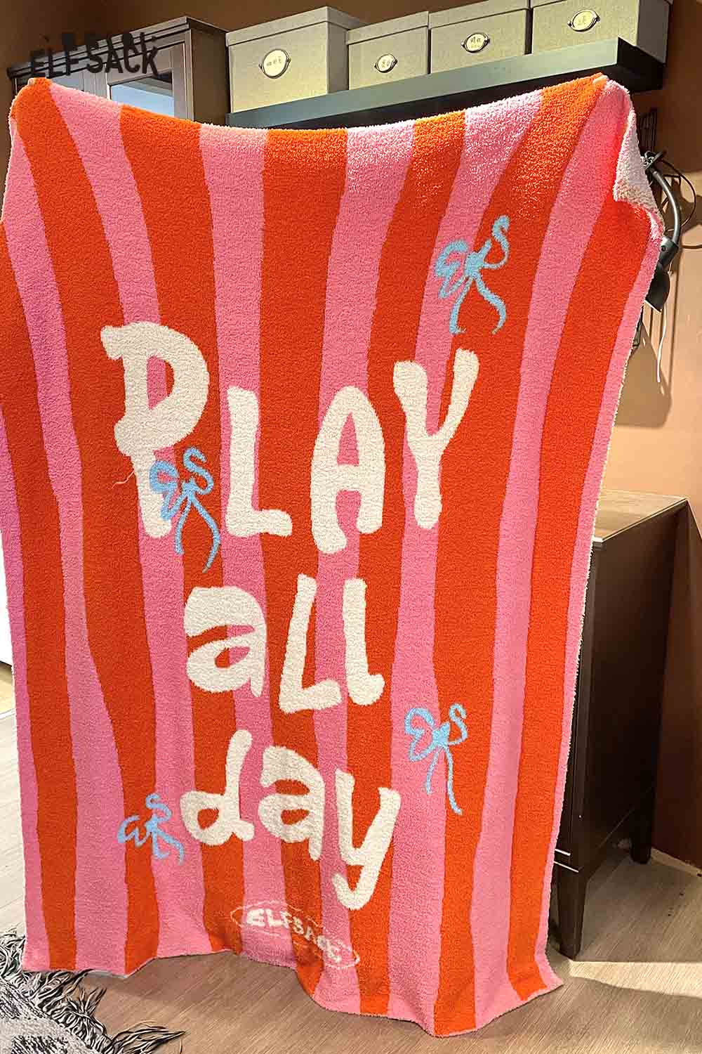 ELFSACK striped color block home blanket featuring playful 'PLAY all day' design with pink and orange stripes
