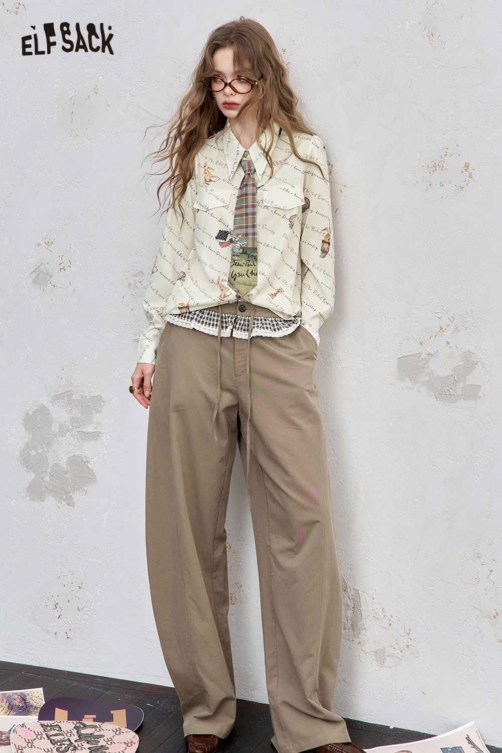 ELFSACK women's printed shoulder shirt with unique patterns paired with loose pants for a stylish look