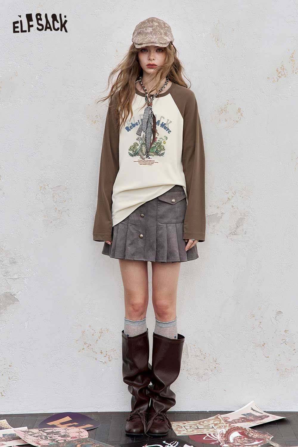 ELFSACK women's raglan sleeve graphic tee styled with a brown skirt and knee-high boots