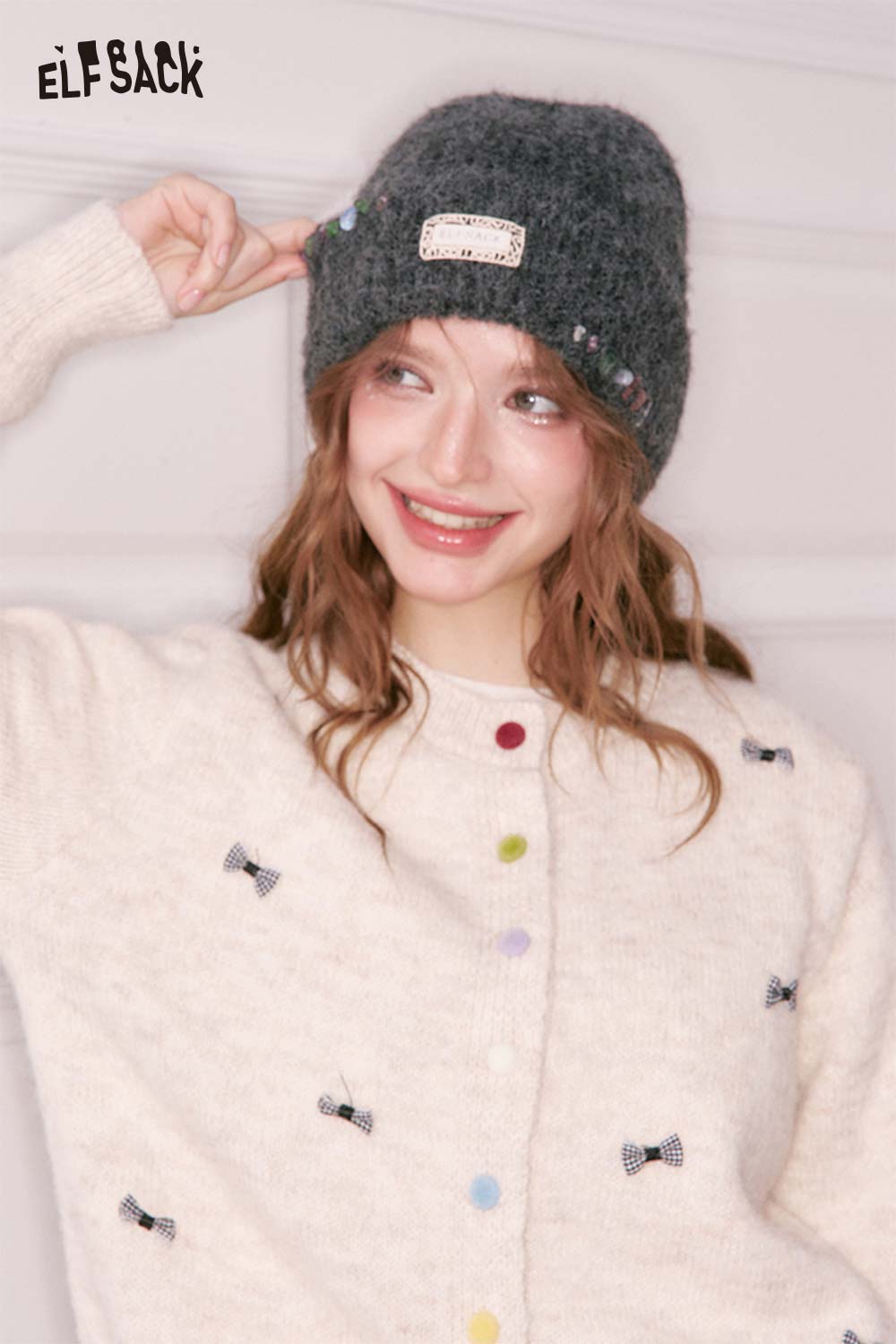 ELFSACK women's solid color beanie in gray, styled with a cozy cream cardigan featuring colorful buttons
