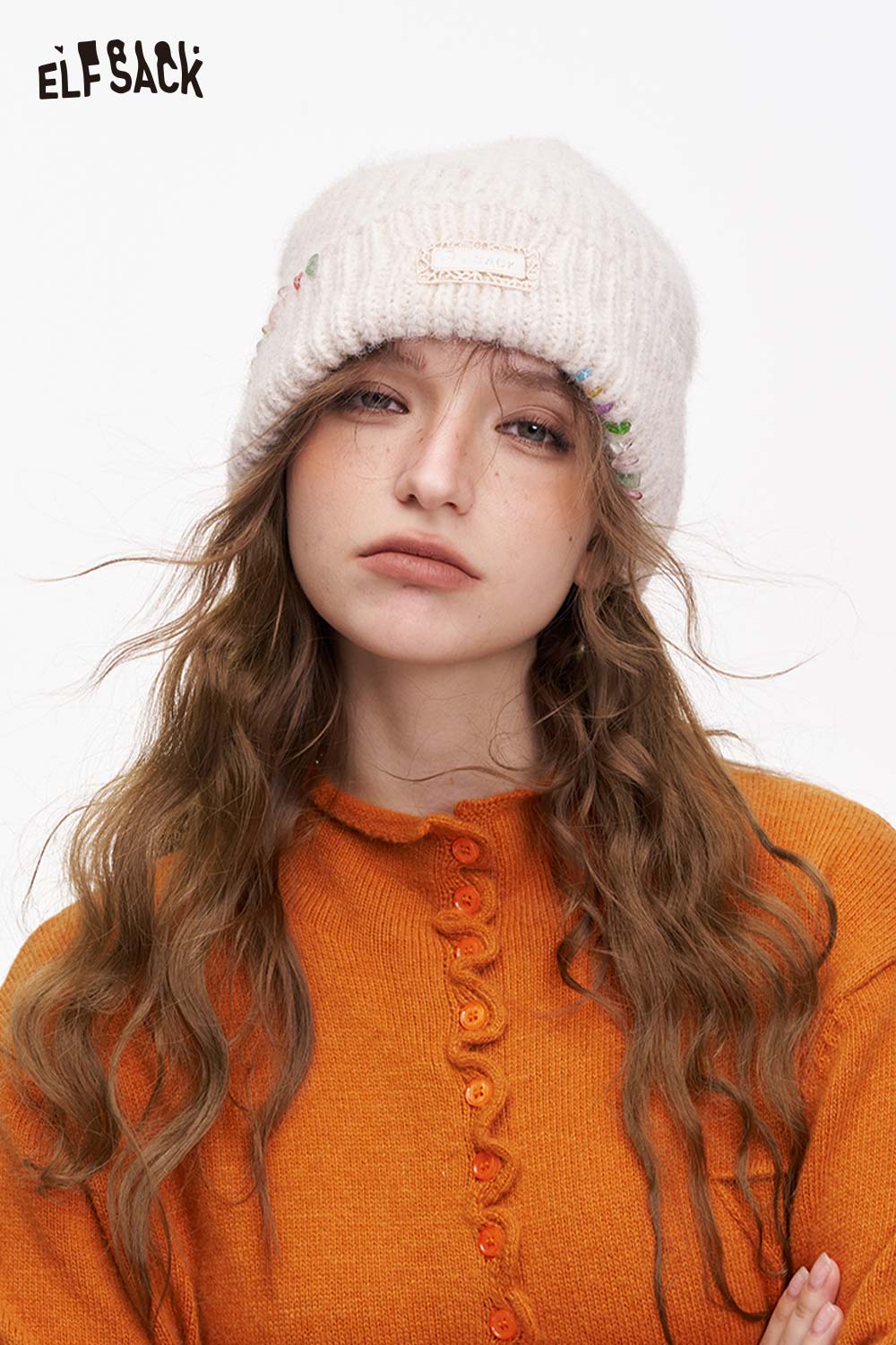 ELFSACK women's solid color beanie in cream with floral embroidery, perfect for winter fashion.