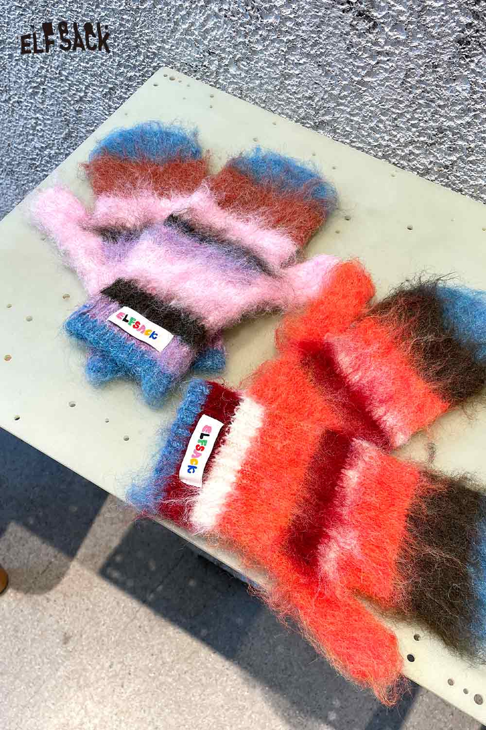 Colorful ELFSACK Y2K stripe neck warmer made of soft, fuzzy material for stylish winter wear