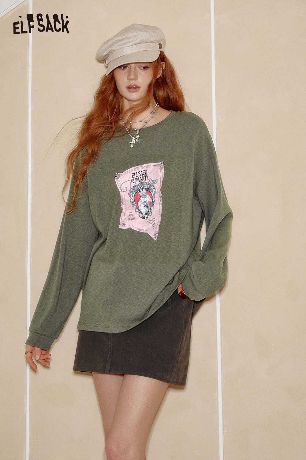 Women's graphic print t-shirt by ELFSACK in olive green with a unique design and relaxed fit