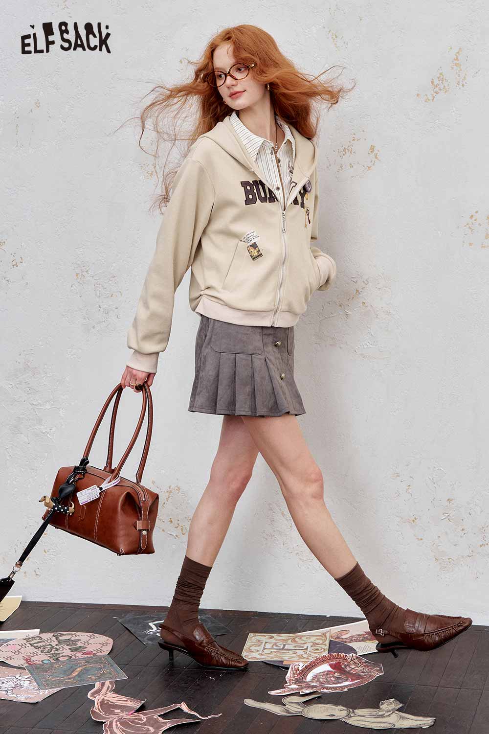 ELFSACK embroidered hooded sweatshirt for women in cream, paired with a skirt and stylish accessories