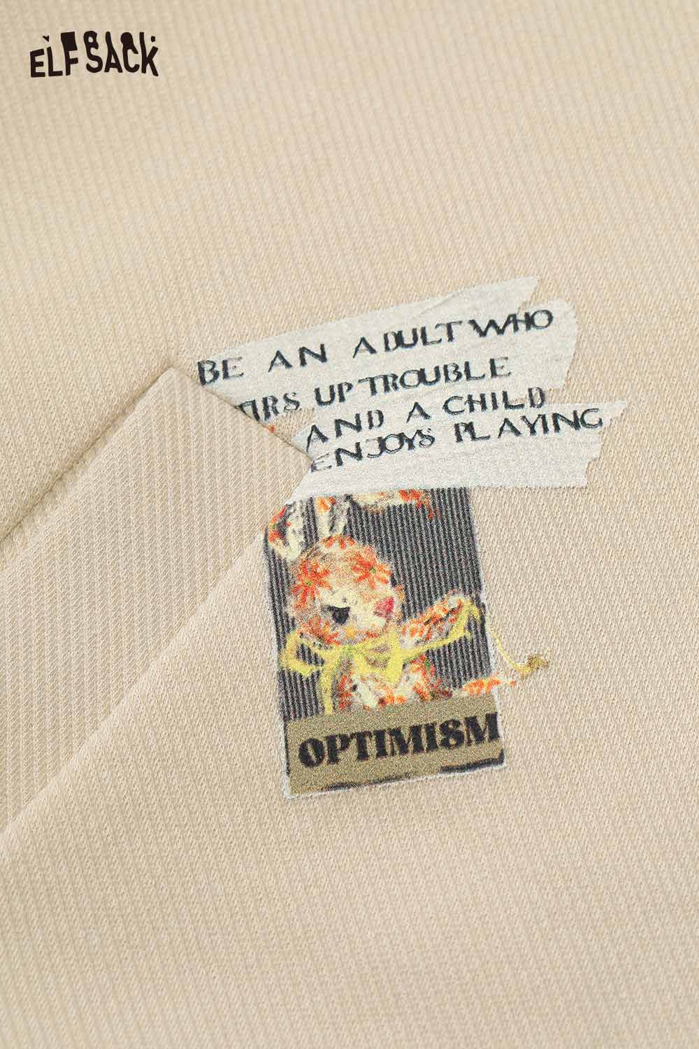 Light beige ELFSACK embroidered hooded sweatshirt for women with playful design and inspirational quotes
