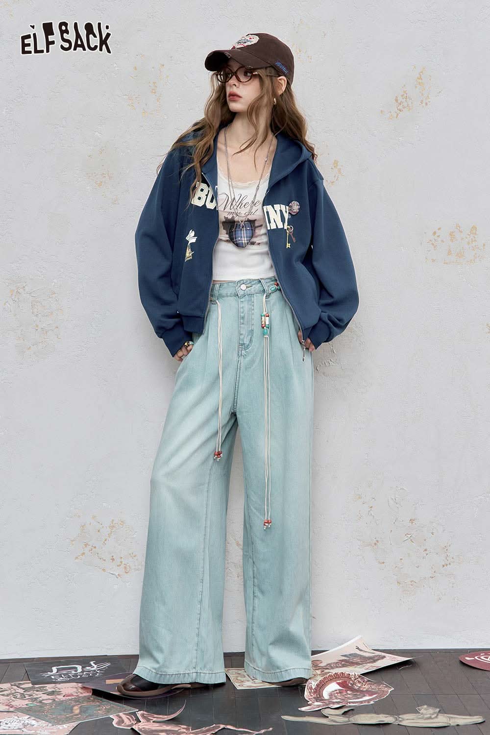 ELFSACK embroidered hooded sweatshirt for women in navy with graphic design, paired with light blue wide-leg pants.
