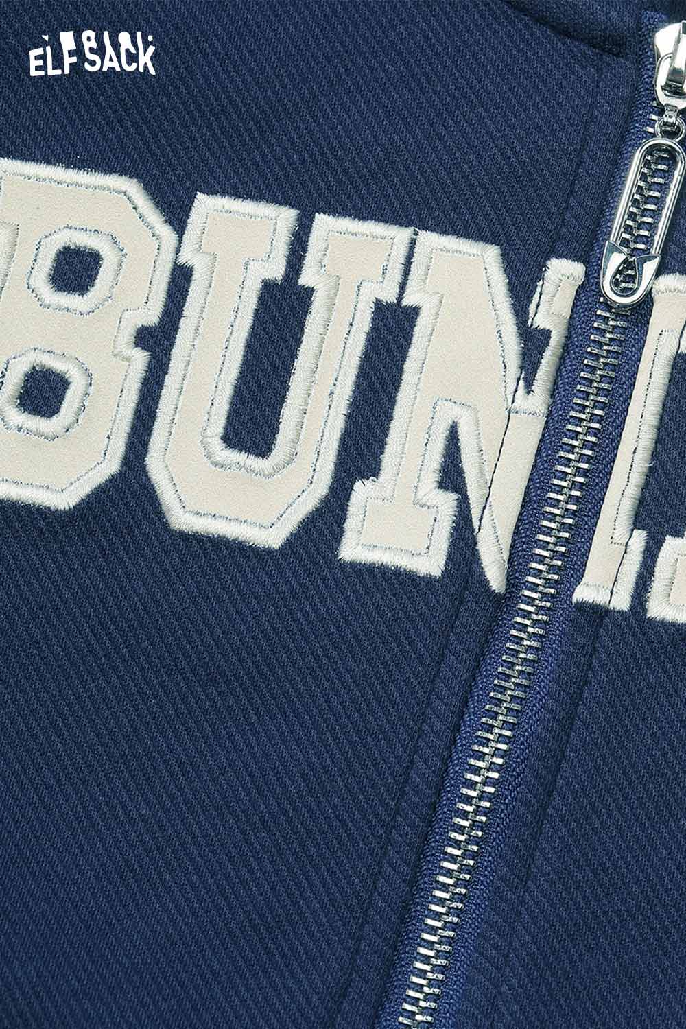 Close-up of ELFSACK embroidered hooded sweatshirt for women featuring bold lettering and a zipper