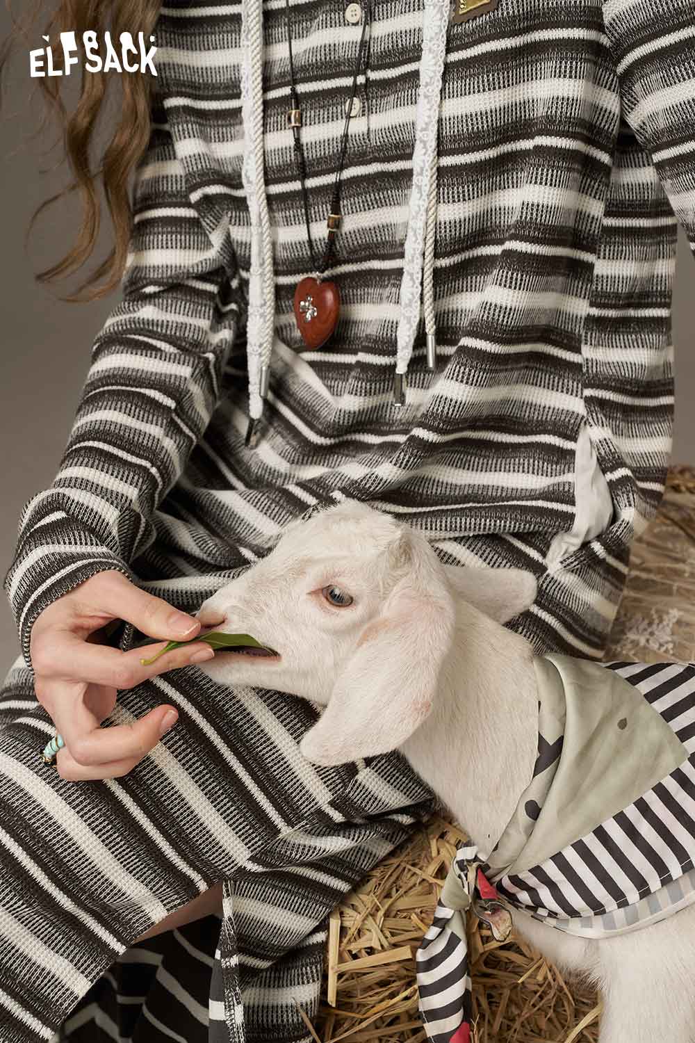 ELFSACK soft star sweatshirt dress featuring a stylish striped design with a playful goat