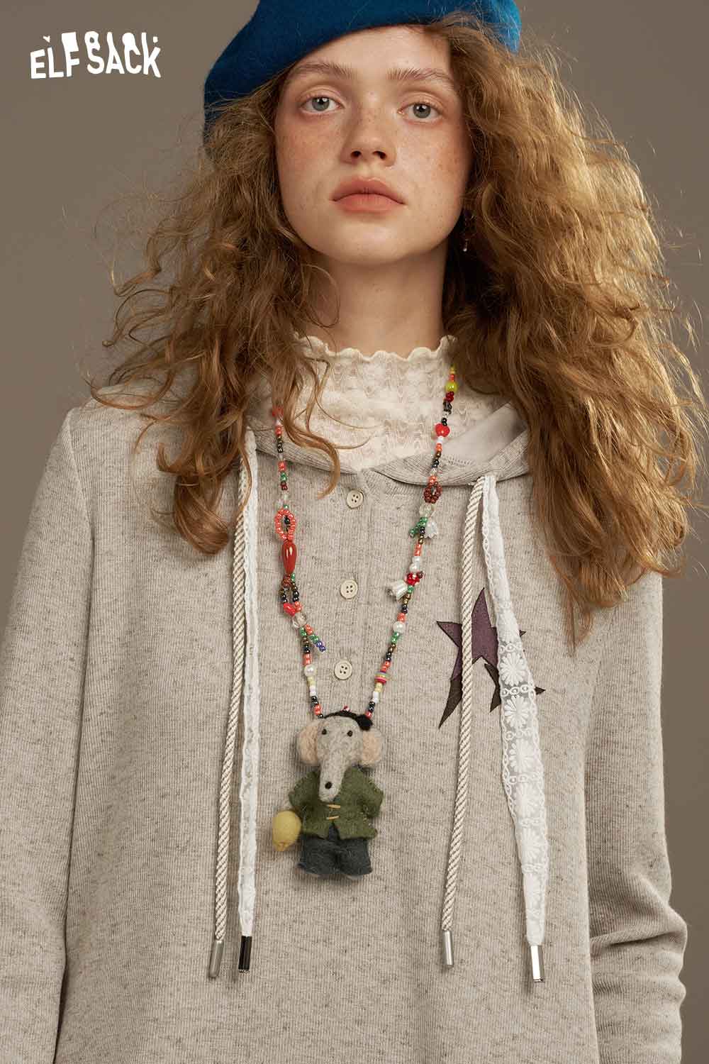 ELFSACK soft star sweatshirt dress in light gray with unique detailing and hoodie style