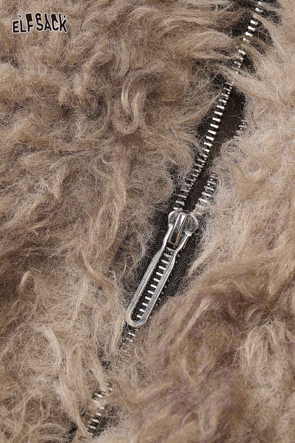 Close-up of ELFSACK faux fur ombre cropped jacket showing zipper detail and textured fabric