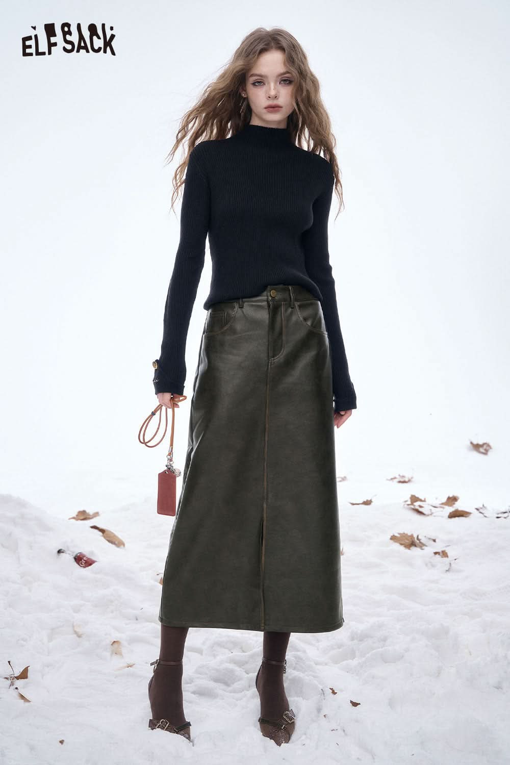 ELFSACK faux leather maxi skirt in olive green paired with a black turtleneck for stylish winter wear