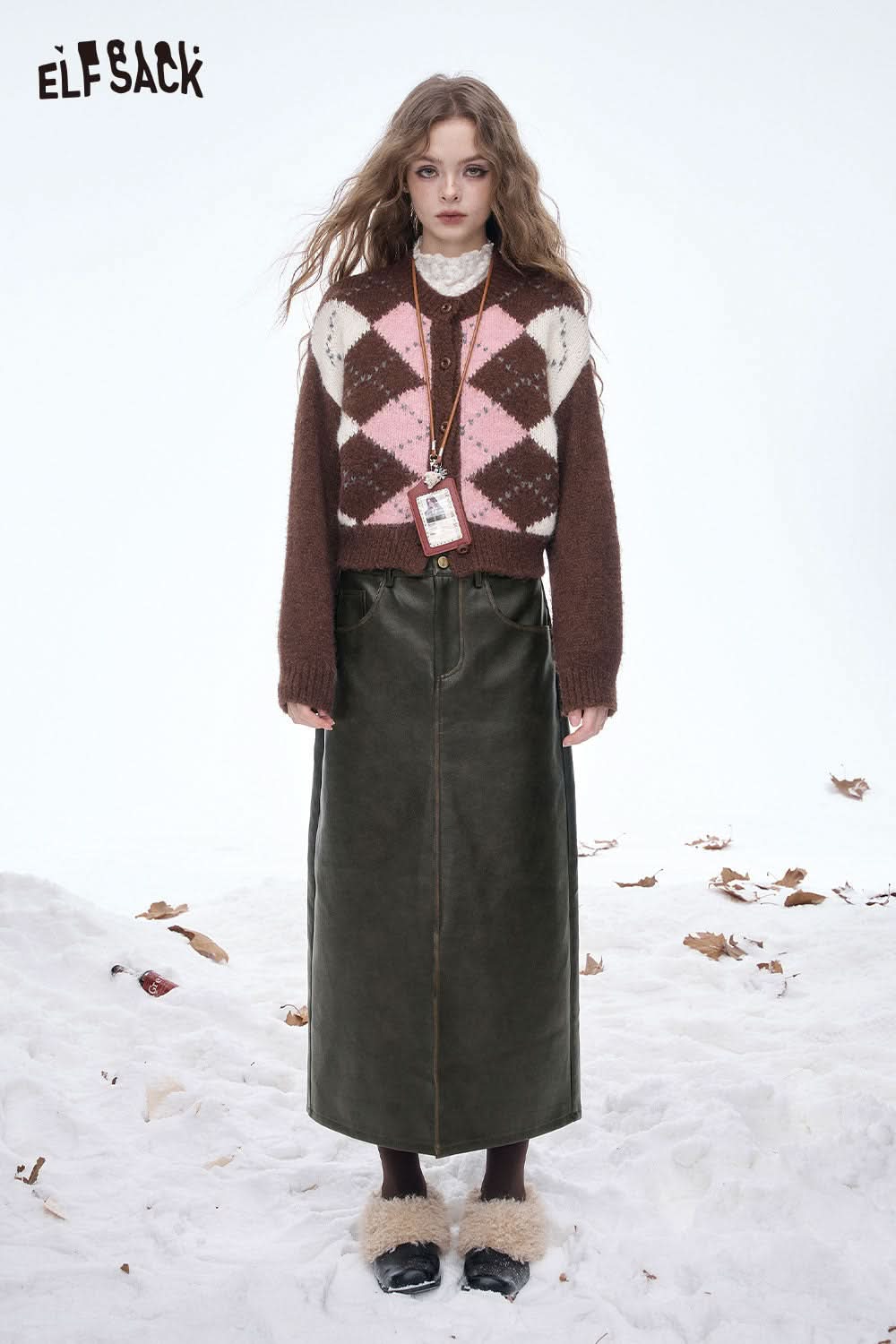 ELFSACK faux leather maxi skirt paired with a cozy sweater in a winter setting