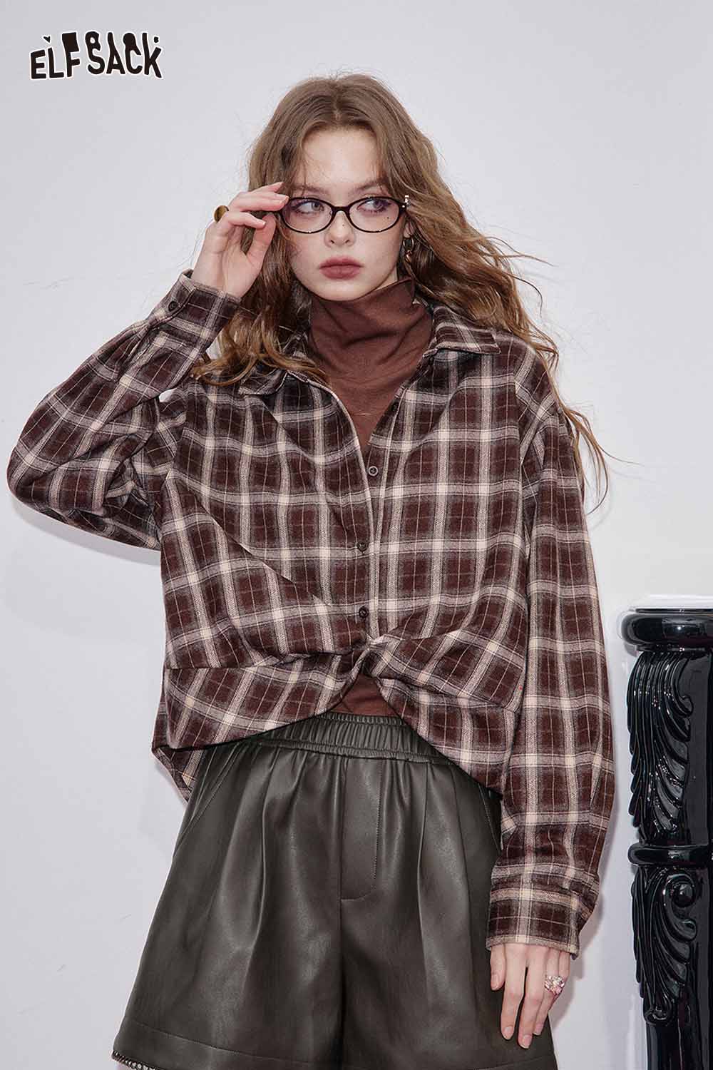Stylish ELFSACK faux leather shorts for women paired with a plaid shirt and sunglasses