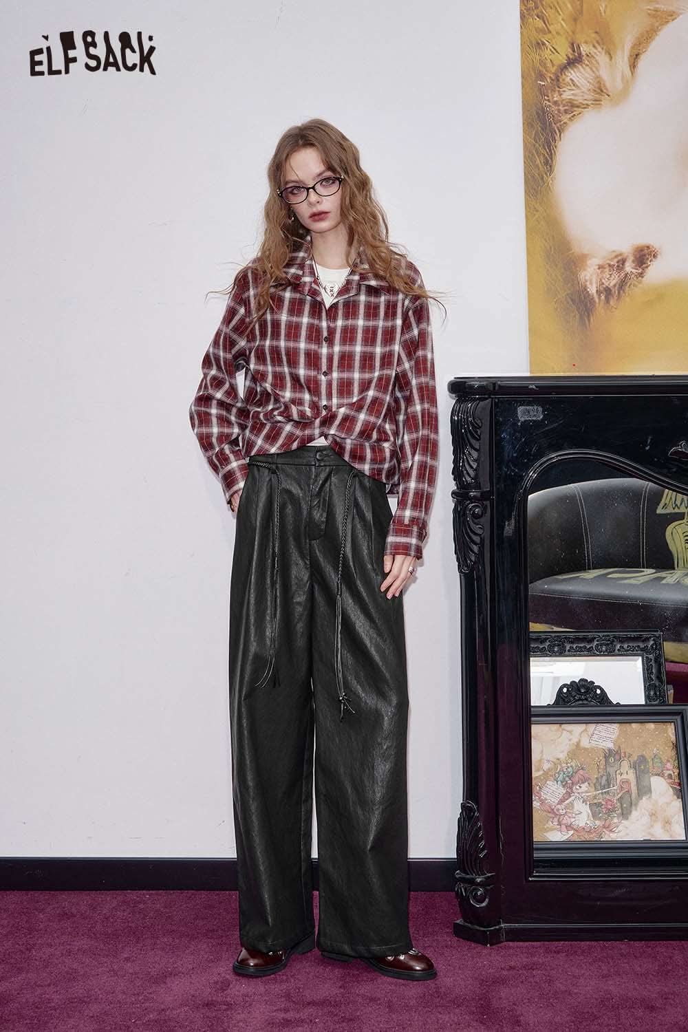 ELFSACK faux leather wide leg trousers styled with a plaid shirt for a trendy look