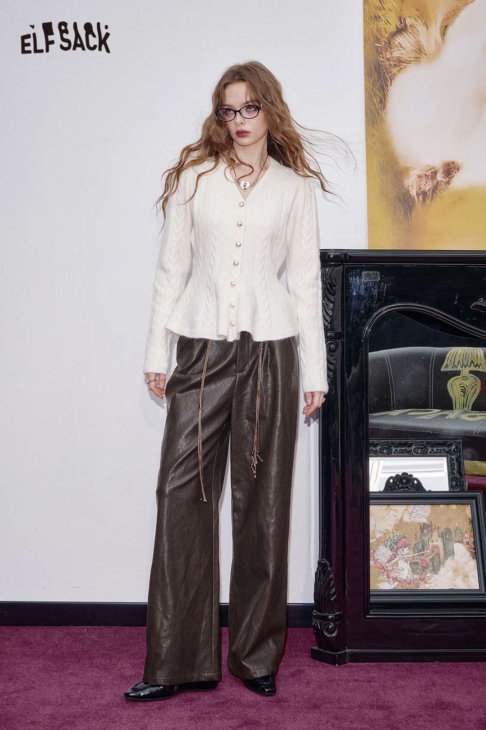 ELFSACK faux leather wide leg trousers styled with a cream cardigan and glasses for a fashionable look