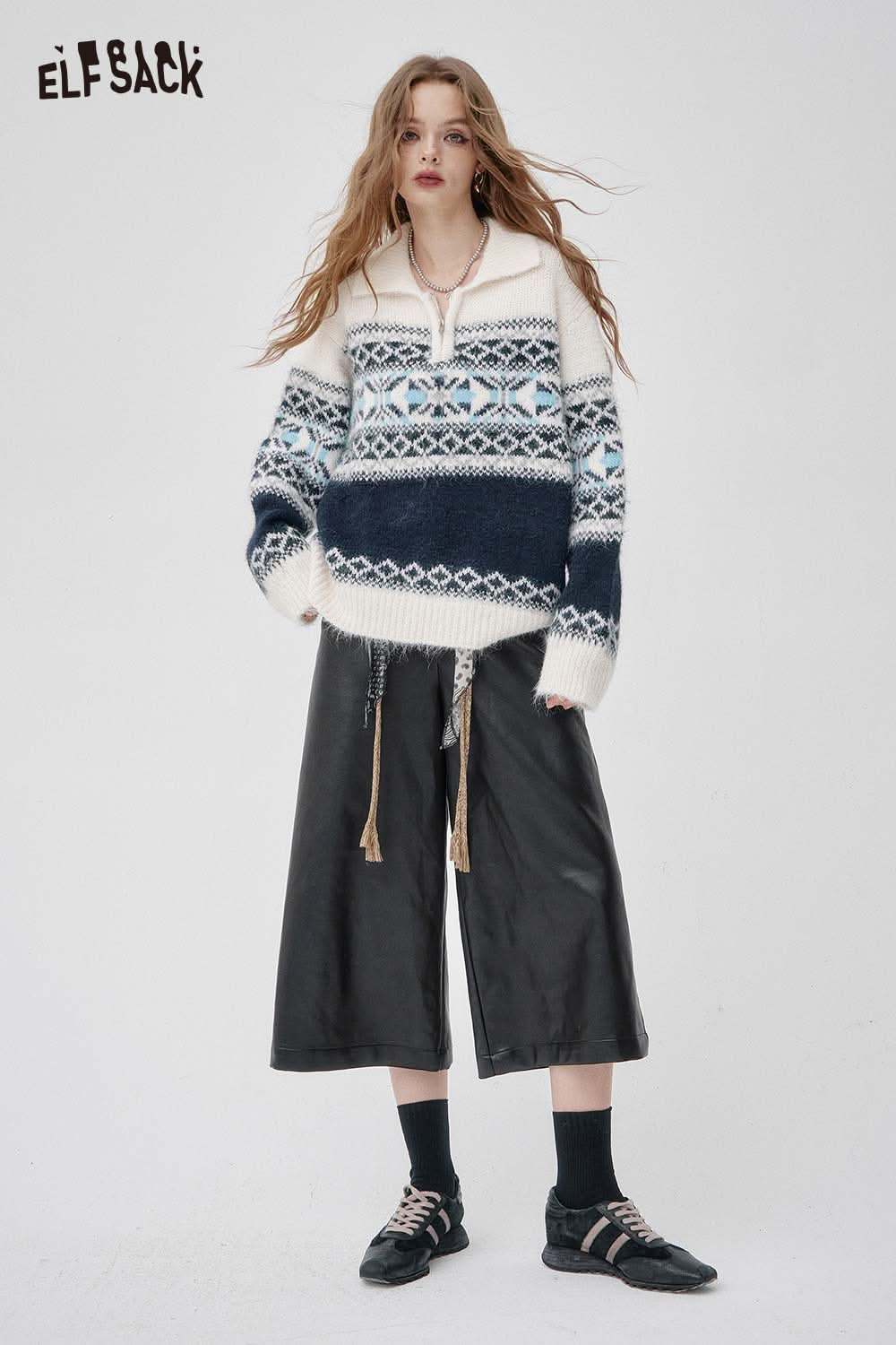 ELFSACK faux leather wide leg trousers paired with a cozy patterned sweater for a trendy winter look