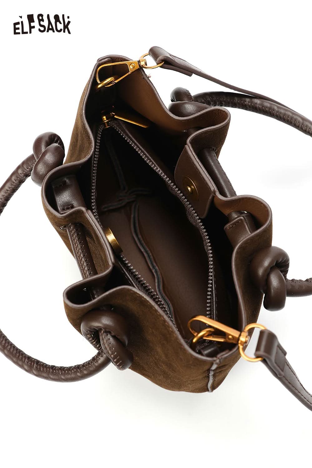 Inside view of ELFSACK faux suede bucket bag showing compartments and zippers in a rich brown color