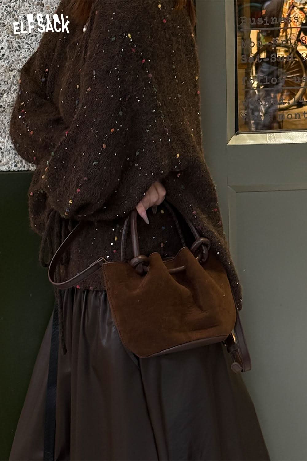 Stylish ELFSACK faux suede bucket bag paired with a cozy brown sweater for a chic look