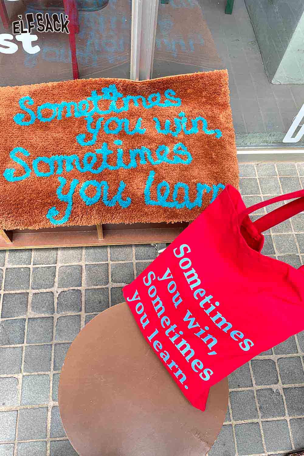 ELFSACK red tote bag and felted wool rug with typography showcasing a motivational quote