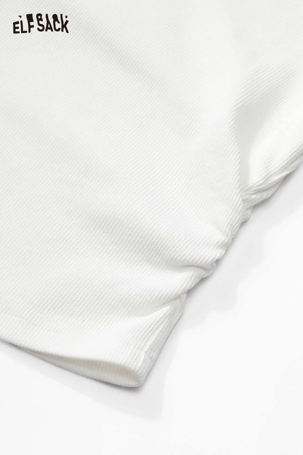 Close-up of ELFSACK fitted hooded tee for women with a soft white fabric and gathered hem detail