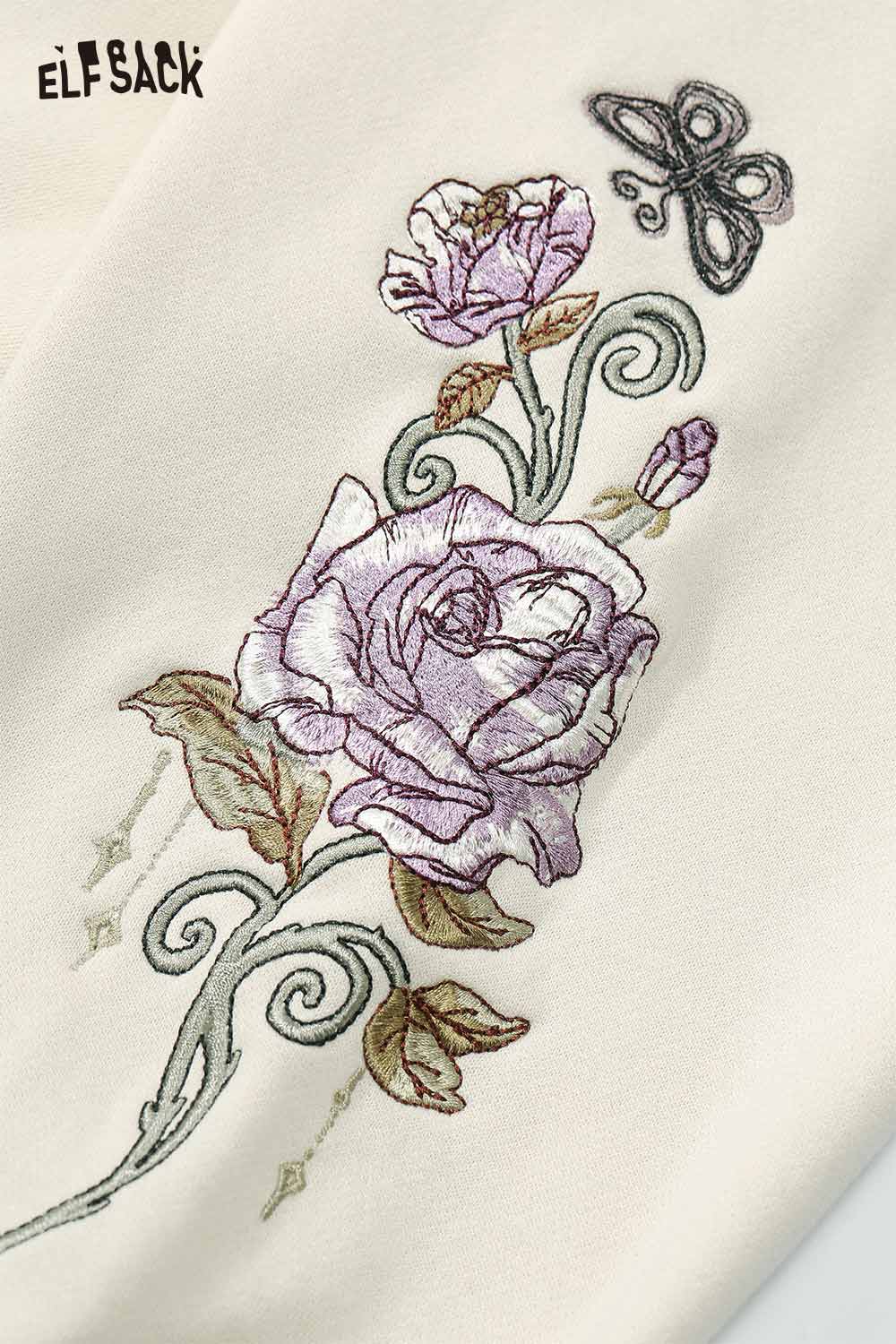 ELFSACK floral graphic tassel hoodie for women featuring elegant floral embroidery design