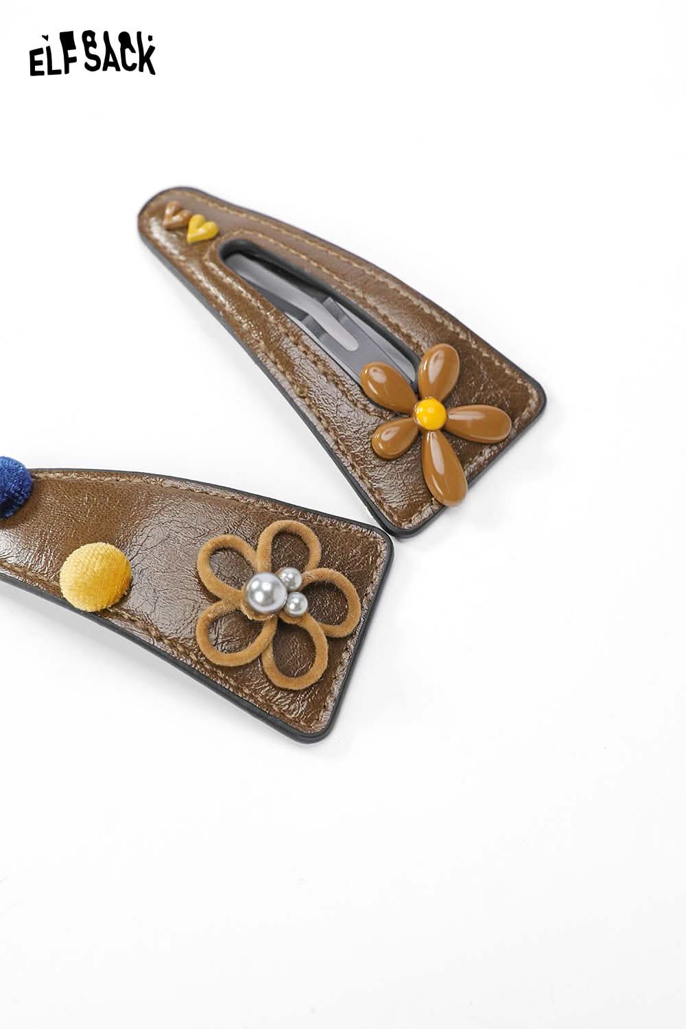 ELFSACK floral hair clip accessory in brown with decorative flowers and pom poms for stylish hair styling