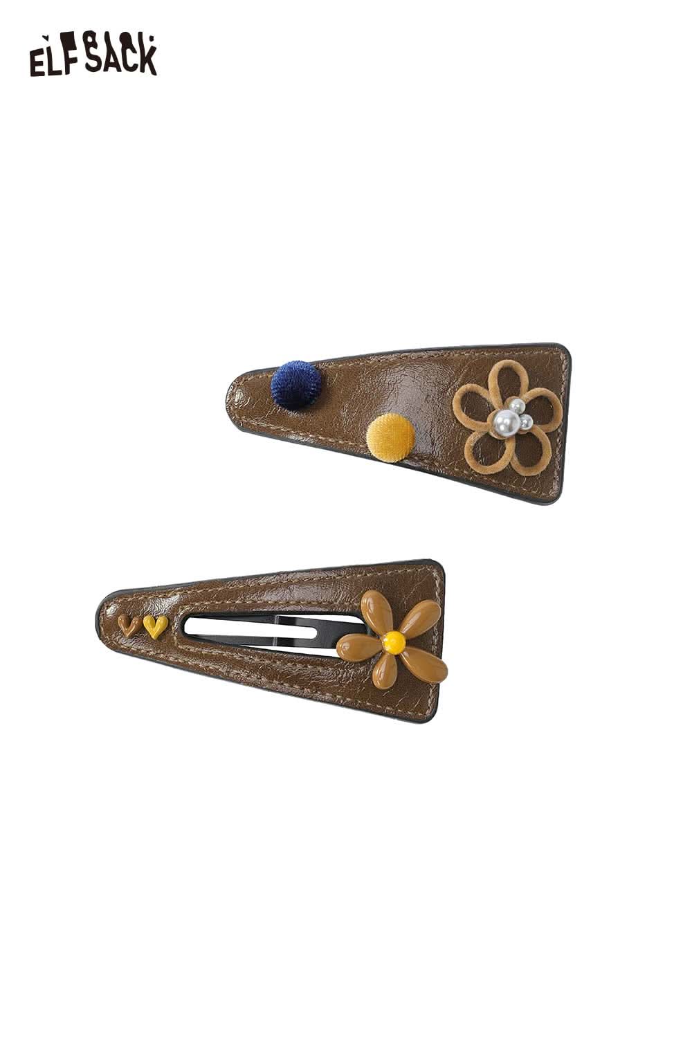 ELFSACK floral hair clip accessory featuring vibrant flowers and playful embellishments