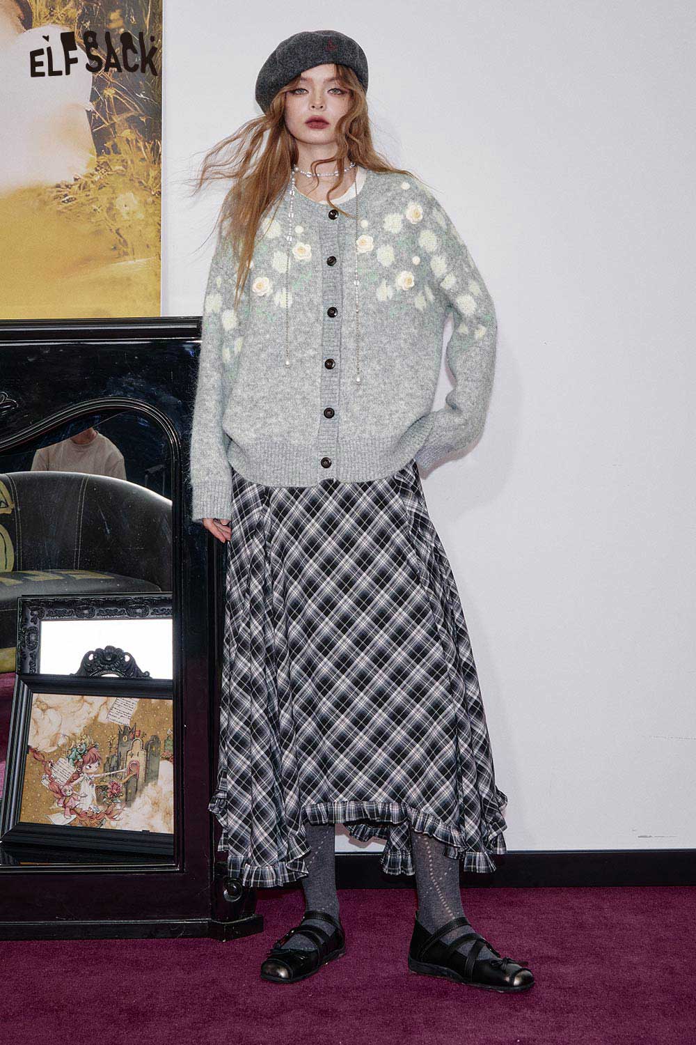 ELFSACK floral stitch oversized cardigan in gray with button closure and floral design, styled with a plaid skirt