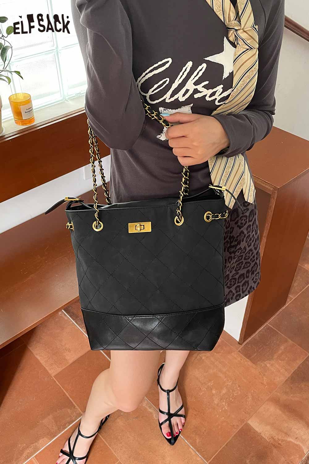 ELFSACK genuine leather bucket bag featuring a quilted design and chain straps with a stylish outfit