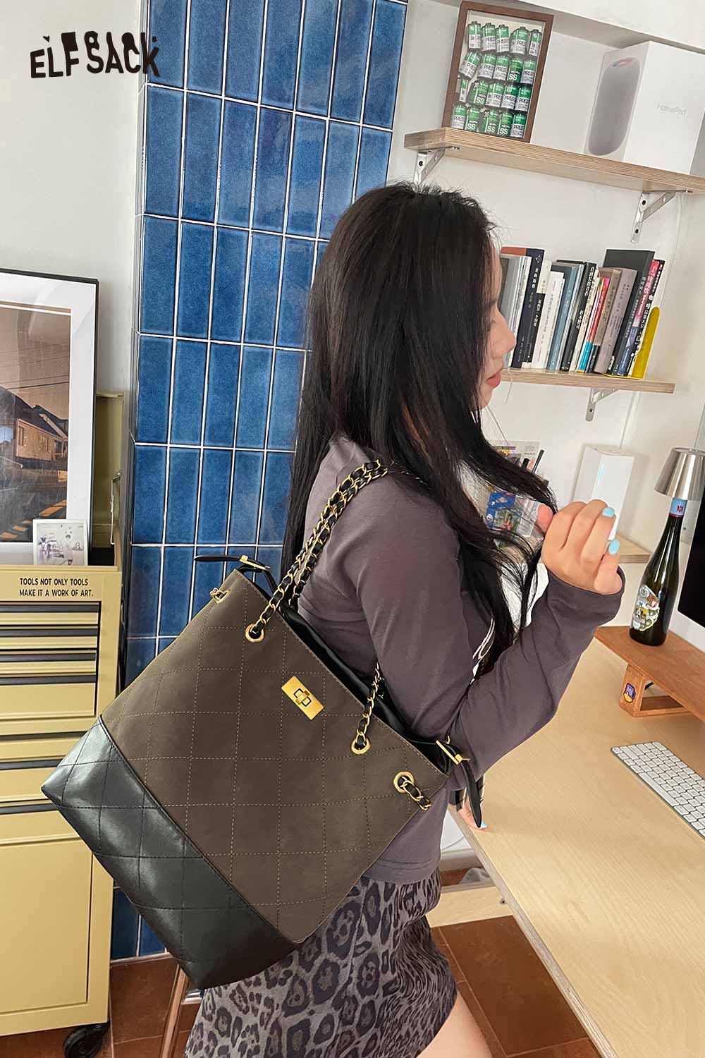 ELFSACK genuine leather bucket bag in brown with stylish design and chain straps for everyday use