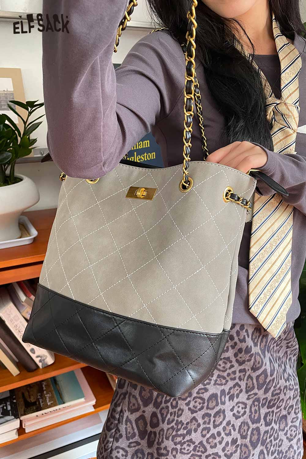 Stylish ELFSACK genuine leather bucket bag with chain strap and quilted design in beige and black