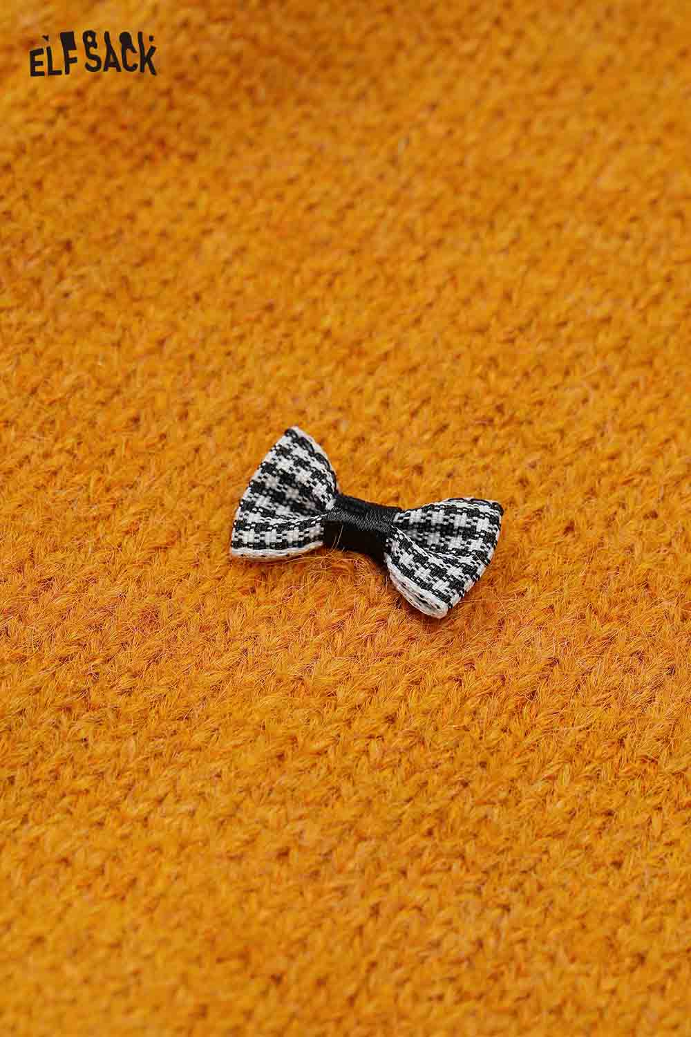 ELFSACK girly bow cardigan in vibrant orange featuring a black and white checkered bow detail